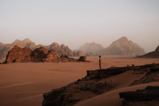 Explore the vast and breathtaking landscapes of Wadi Rum, Jordan's iconic desert, at sunset.