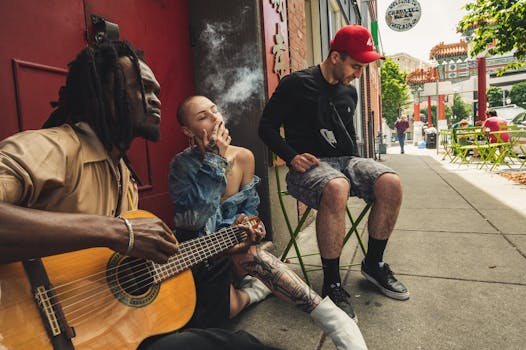 Group of musicians enjoying a jam session on a city street, showcasing urban culture and diversity.