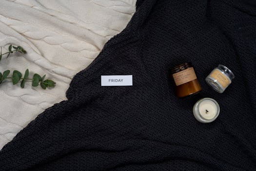 A relaxing Friday scene with candles and blankets for a warm, cozy atmosphere.