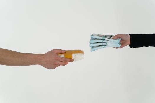 Conceptual image of a drug deal exchange showing money for a substance in two hands.