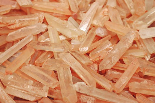 An artistic close-up of raw peach-colored Himalayan salt crystals showing natural texture.