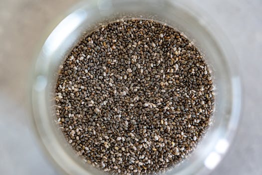 High-angle view of <a href='https://amzn.to/48FohoW' target='_blank'></img>chia seeds</a> in a glass jar, perfect for healthy cooking.