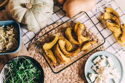 Warm rustic food setup with roasted pumpkin and squash, perfect for autumn meals.